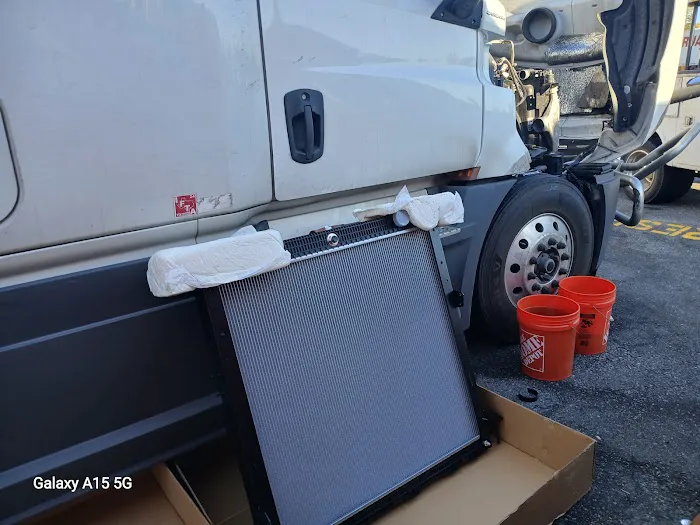 Diagnostic laptop connected during a diesel truck service